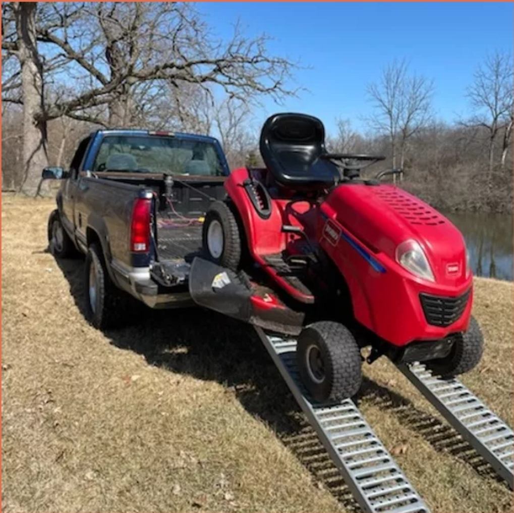 Loading a riding mower onto our trailer in McHenry County